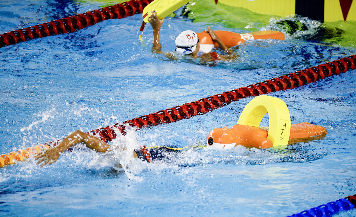 Once dummies are rescued from the bottom of the pool, they’re attached to rescue tubes and towed.